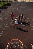 High angle view of multiethnic sportsmen playing basketball