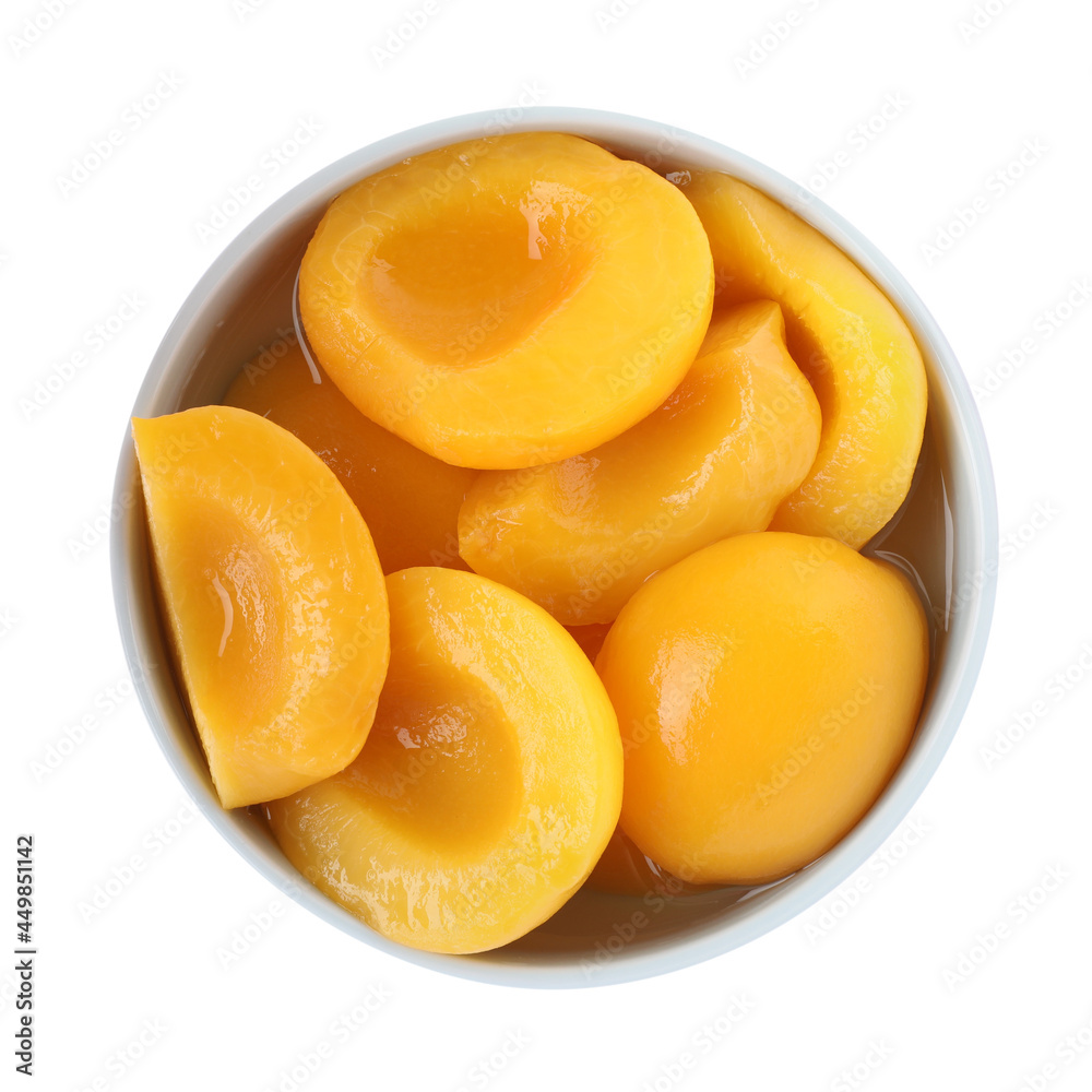 Halves of canned peaches in bowl isolated on white, top view Halves of canned peaches in bowl isolated on white, top view