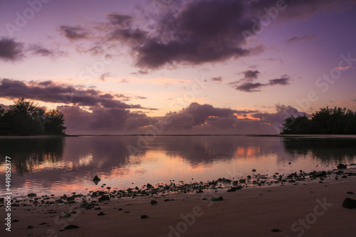 a group of clouds in the sky over a body of water