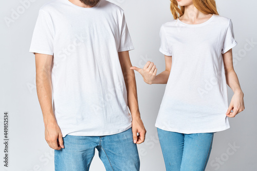 man and woman in white t-shirts cropped view mocap advertisement