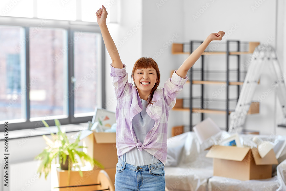 people, repair and real estate concept - happy smiling asian woman with stuff moving to new home people, repair and real estate concept - happy smiling asian woman with stuff moving to new home