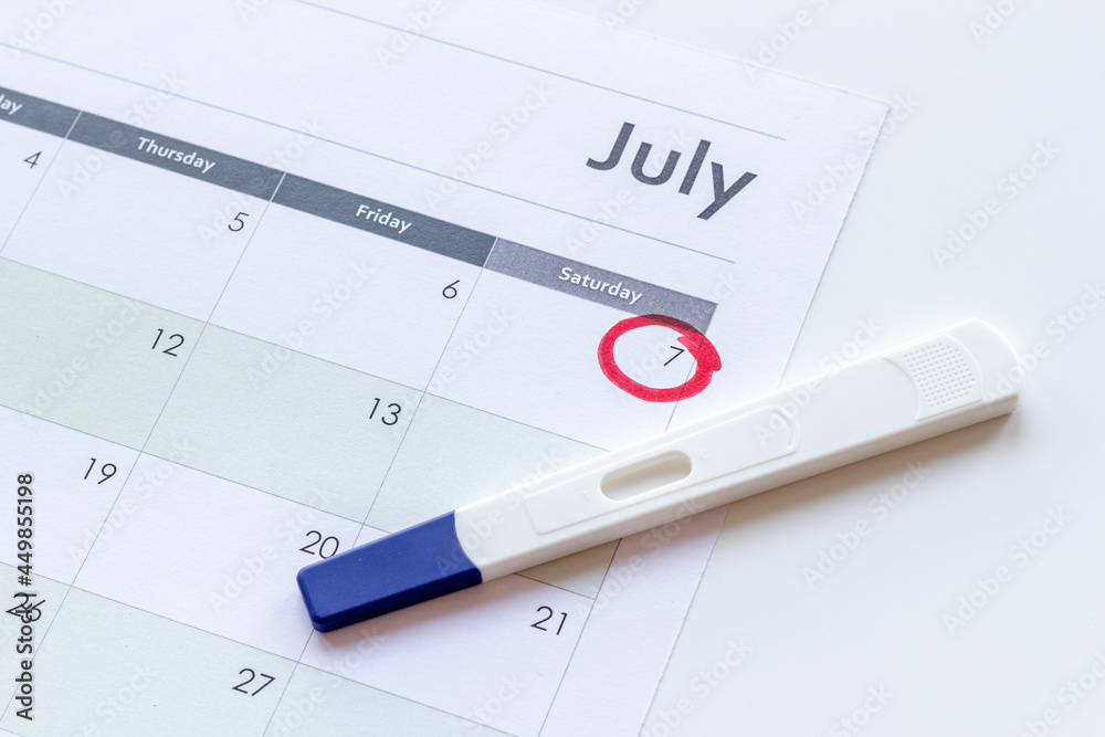 Pregnancy test on calendar. Time to check pregnancy day Pregnancy test on calendar. Time to check pregnancy day