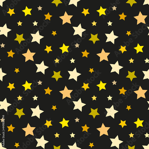 Seamless pattern in yellow and light orange stars on black backgound. Vector image. © Asahihana