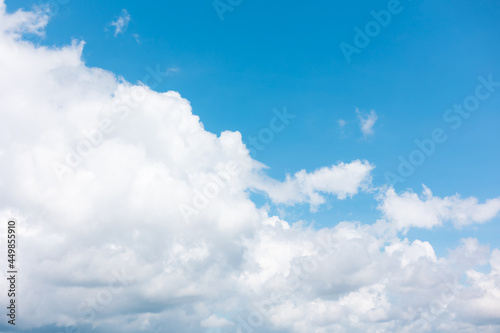 blue sky background with tiny clouds.