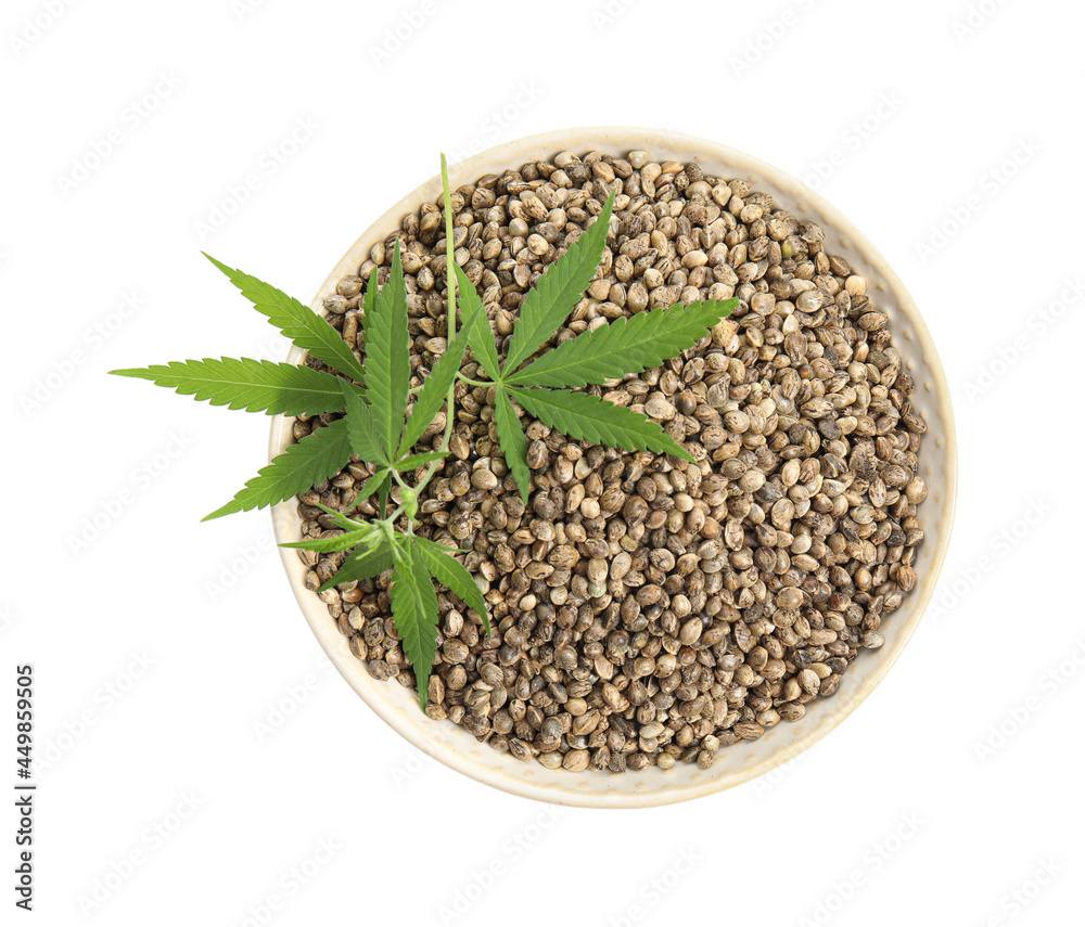Bowl with hemp seeds and leaves on white background, top view Bowl with hemp seeds and leaves on white background, top view