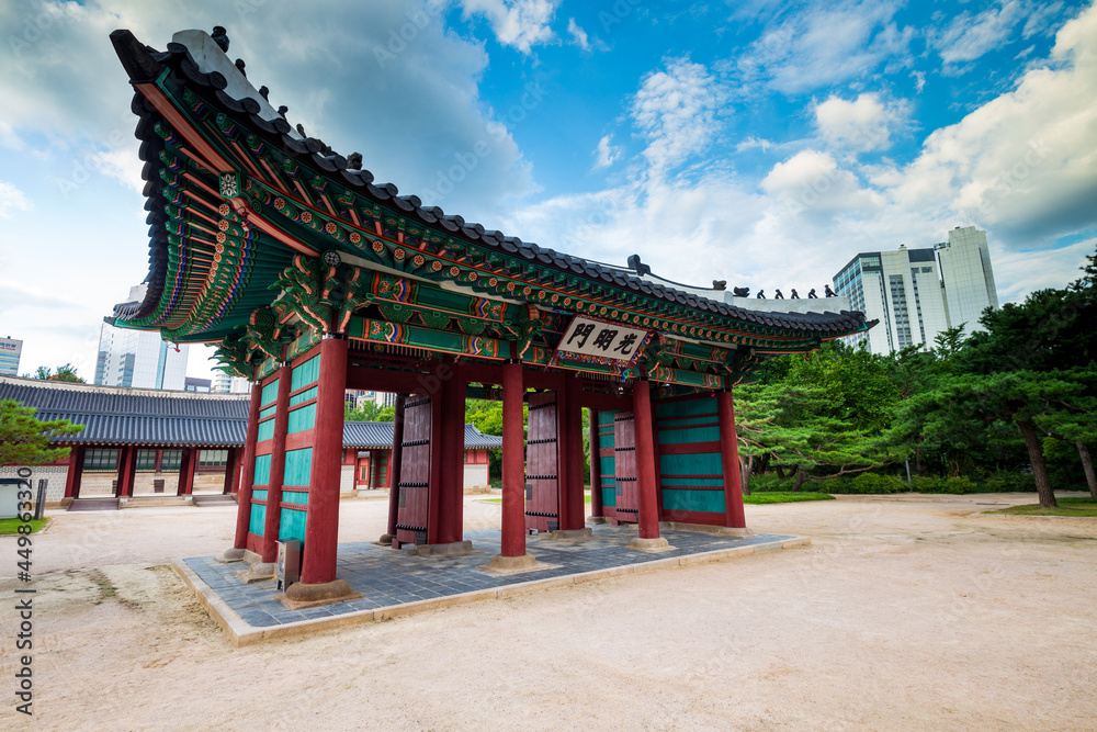 Side view of Gwangmyeongmun Gate in Deoksugung Palace, translation of inscription means Gwangmyeongmun, the name of the gate. Seoul, South Korea.