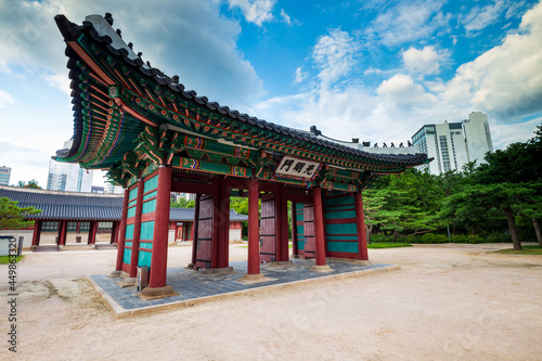 Side view of Gwangmyeongmun Gate in Deoksugung Palace, translation of inscription means Gwangmyeongmun, the name of the gate. Seoul, South Korea. © Ovnigraphic