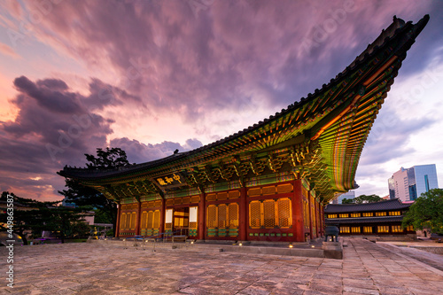 Side view of Junghwajeon the main hall of Deoksugung Palace at sunset. Inscriptions under the roof means Junghwajeon and name the hall. Seoul, South Korea.