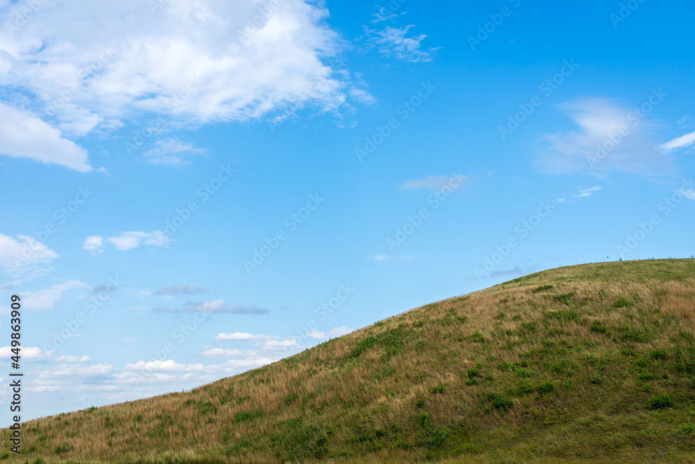 Summer mountain green grass and blue sky white clouds landscape