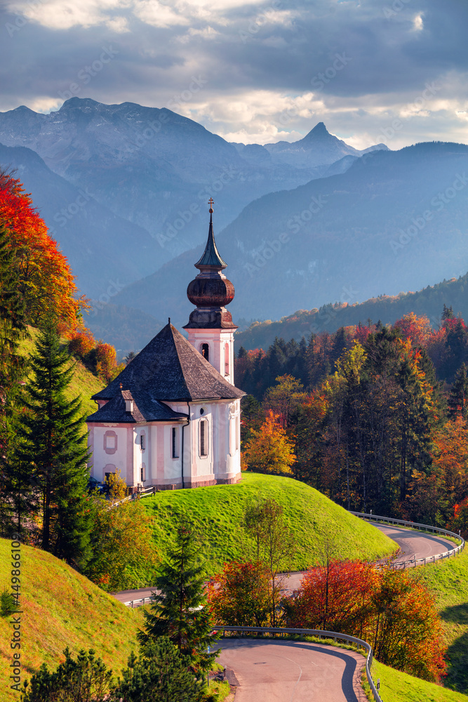 Autumn in Bavarian Alps. Landscape image of the Bavarian Alps with Maria Gern Church and Watzmann mountain during beautiful autumn sunset.