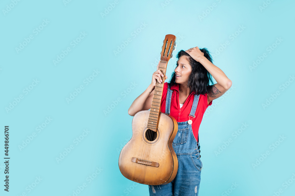 Obraz premium singer with acoustic guitar. music and art. musical shop. happy girl enjoy the moment. Have Fun on Celebration. woman singing with guitar. young hipster playing on guitar