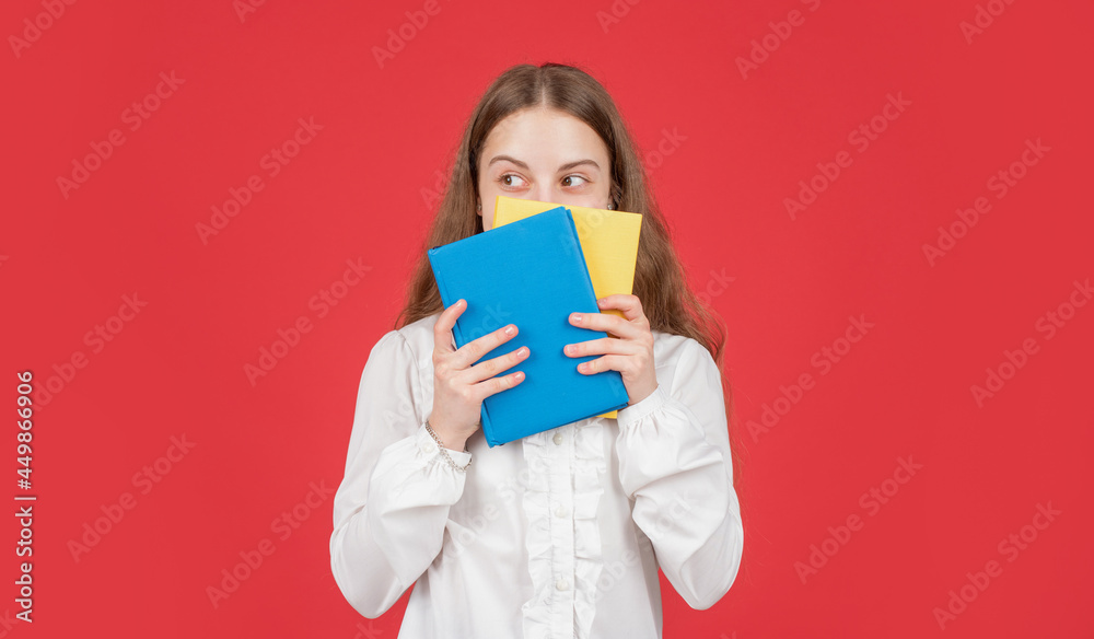 kid in white shirt ready to study do homework behind book on red background, knowledge kid in white shirt ready to study do homework behind book on red background, knowledge