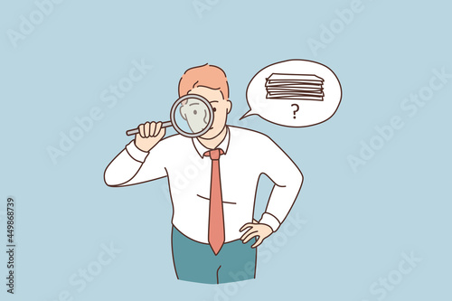 Searching for money or documents concept. Young attentive businessman cartoon character standing looking at magnifier trying to find money or official documents vector illustration 