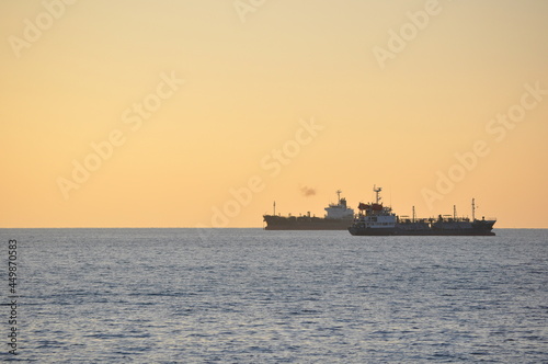 Shipping ships on the sea at sunset