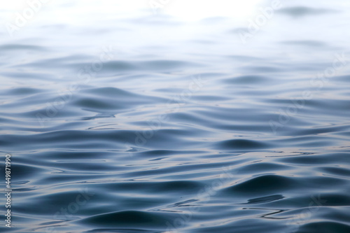 blue water surface, ripples on the sea, copy space.