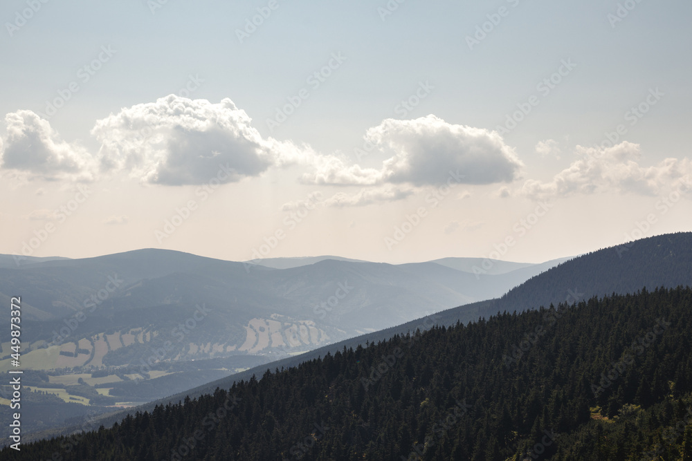 View at mountains range and sky from Serak mountain peak at summer day. Nature in Jeseniky national parkland, Czech Republic
