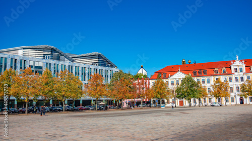 View over major old market square with modern architecture in Magdeburg near Cathedral and Government Offices, at sunny day and blue sky and Autumn colors