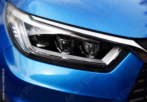 Headlight. LED headlamp of a modern car. Frontal lighting of highway vehicles with daytime running lights. Cars ambient lighting. Bi-Xenon headlamps and LED automotive lighting of a next generation.