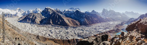 Panorama witn Himalaya mountains. Mount Everest (8,848 m) and the Glacier from the summit of Gokio Ri, Himalayas, Nepal. photo