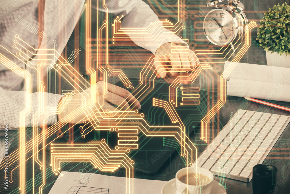 Double exposure of man's hands holding and using a digital device and tech theme hologram drawing. Technology concept. Double exposure of man's hands holding and using a digital device and tech theme hologram drawing. Technology concept.