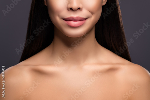 Cropped photo of tender dream lady smile presenting aesthetic collarbones isolated grey color background
