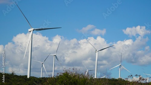 Windm ills and a wind farm on the hillsides. Philippines, Luzon. Wind turbines in the mountains. photo