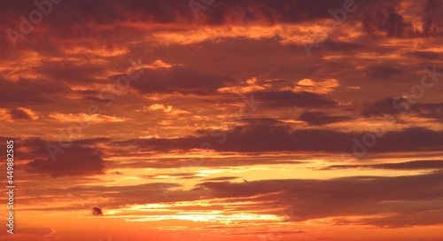 Beautiful orange fiery sunset in the sky, natural background 