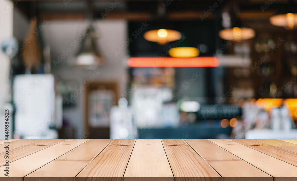 Empty wooden table top on blur restaurant background. Empty wooden table top on blur restaurant background.