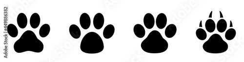 Paw print set. Paw foot trail print of animal. Dog, cat, bear, puppy silhouette. Collection of paw prints. Different animal paw - stock vector.