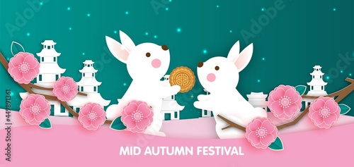 Mid Autumn Festival banner with cute rabbits in paper cut style.