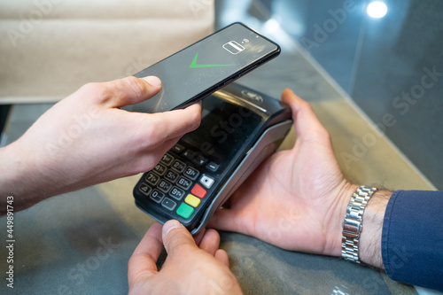 Wallpaper Mural Contact less payment via smartphone. Conclusion of a money transaction through modern POS payment methods Torontodigital.ca