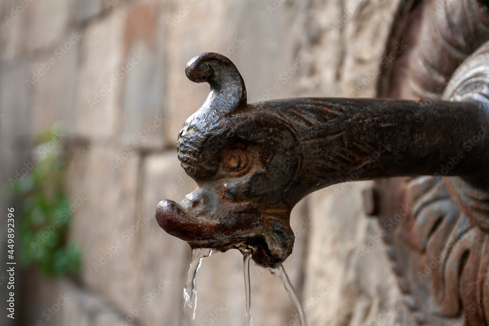 An old water tap in Florence An old water tap in Florence