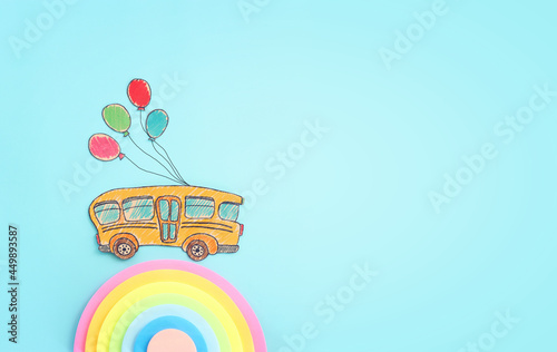 Back to school concept. Top view image of school bus over blue background