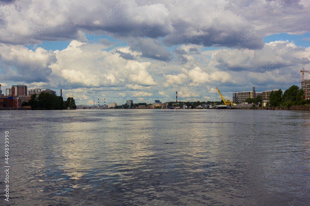 Industrial and residential buildings on the banks of the Neva river in St. Petersburg