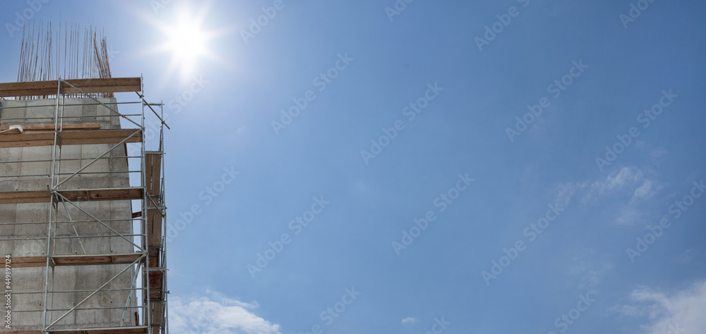 Scaffolding, metal mobile scaffold aginst blue sky background. Banner. Scaffolding, metal mobile scaffold aginst blue sky background. Banner.