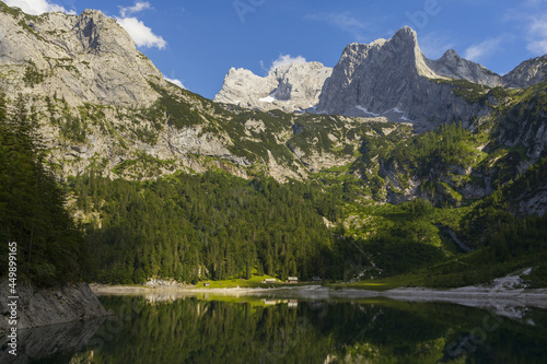 Fototapeta Naklejka Na Ścianę i Meble -  Gosau lake surrounded by Austrian Alps with Hoher Dachstein mountains view and reflections in summer sunny day