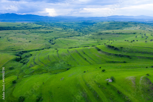 Aerial view of countryside vibrant green hills. Transylvania, Romania