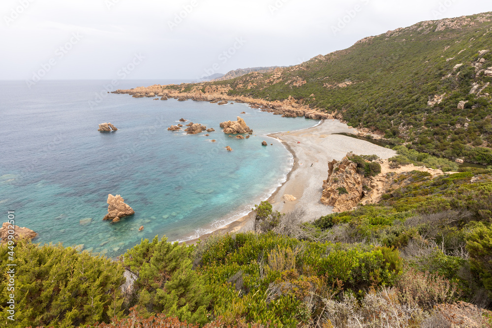 beautiful beach and characteristic reddish rocks of Cala Tinnari, Costa Paradiso. Trinità d'Agultu e Vignola, Sardinia, Italy, Europe