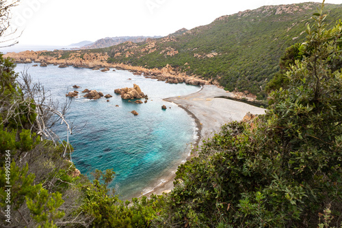 beautiful beach and characteristic reddish rocks of Cala Tinnari,  Paradiso. Trinit?� d'Agultu e Vignola, Sardinia, Italy, Europe photo