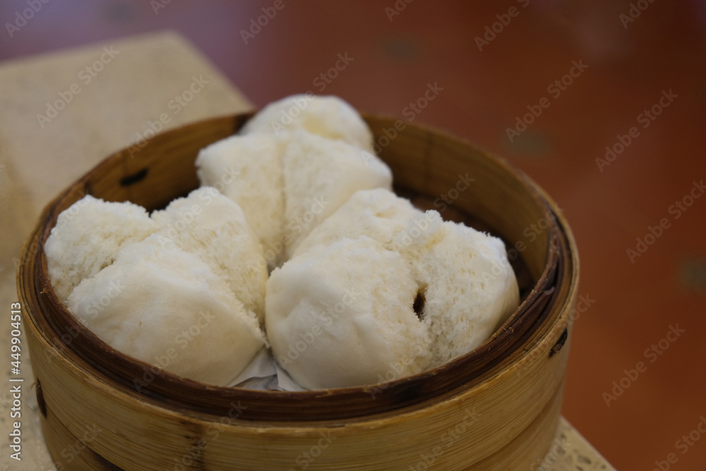 close up steamed bun stuffed with barbecued roast pork. Traditional Chinese dim sum close up steamed bun stuffed with barbecued roast pork. Traditional Chinese dim sum