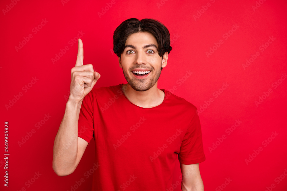 Photo of smart creative guy rise finger have great idea excited face wear red t-shirt isolated red color background Photo of smart creative guy rise finger have great idea excited face wear red t-shirt isolated red color background