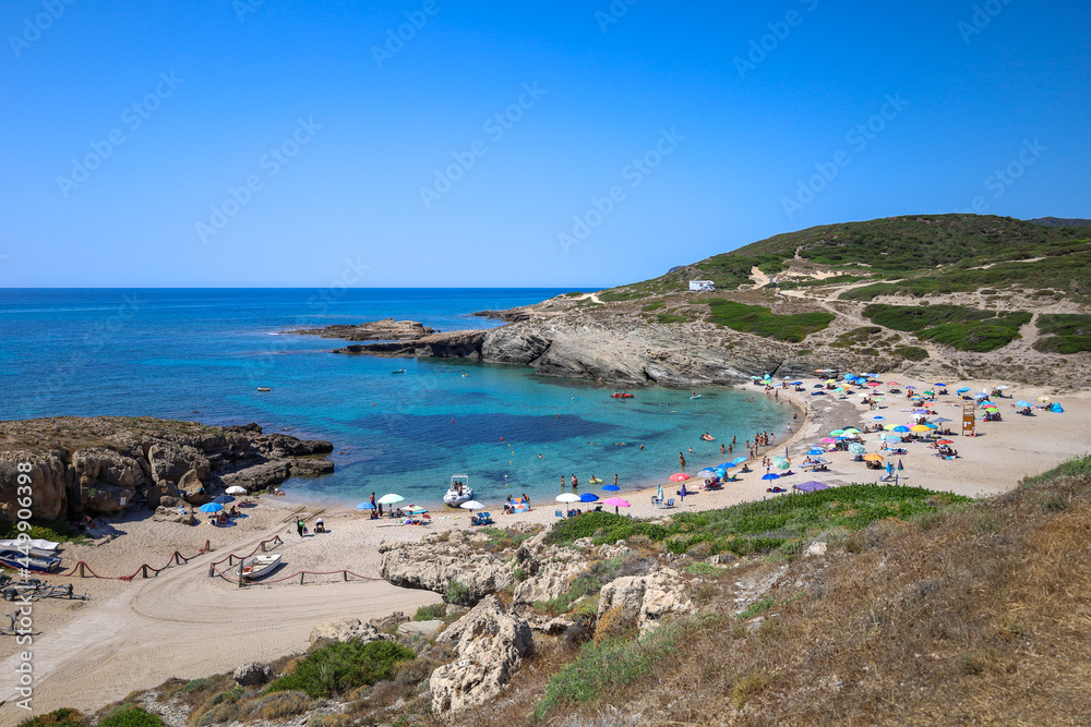 Porto Palmas beach with tourists. Sassari, Sardinia, Italy, Europe