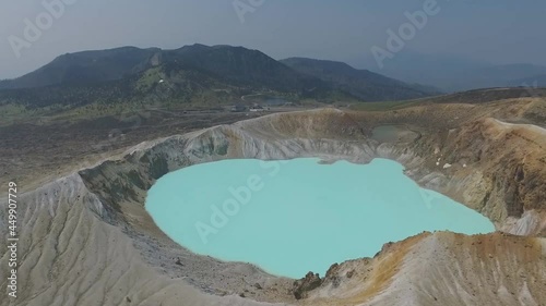 Mysterious color of Yugama_crater lake in Kusatsu Shiraneyama, Japan. (aerial photography) photo