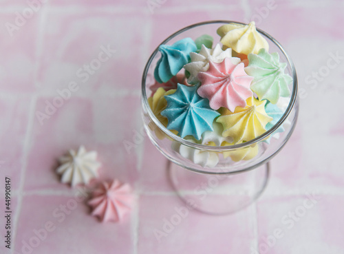 Small colorful meringues in the glass