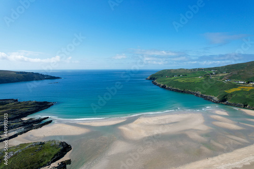 Aerial view of Barleycove beach, a gently curving golden beach formed of an extensive landscape nestled in between the rising green hills of the beautiful Mizen Peninsula in west Cork © bacothelock