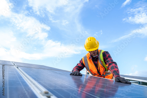 Engineer working on checking equipment in solar power plant,solar power plant to innovation of green energy for life.