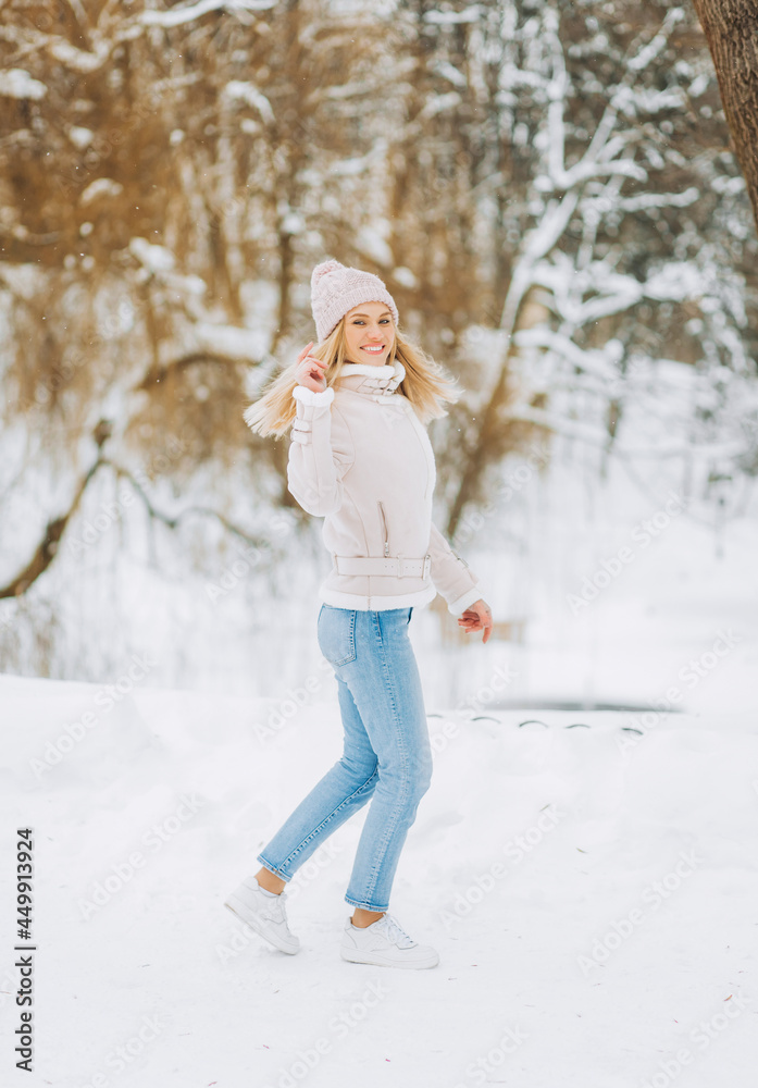 Beautiful young woman in winter time outdoor.  .Winter concept