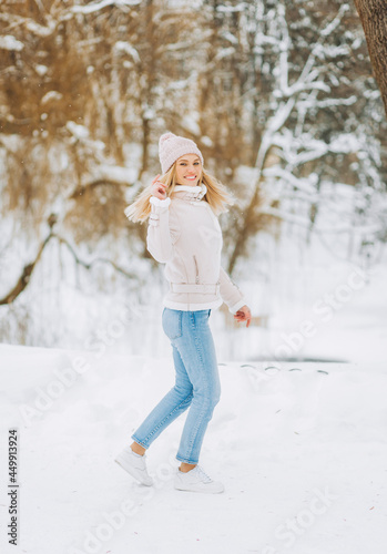 Beautiful young woman in winter time outdoor. .Winter concept