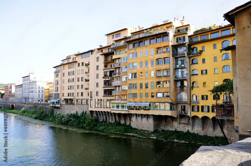 View of the buildings on the river Arno bank from the Old Bridge (Ponte Vecchio). Florence, Italy.