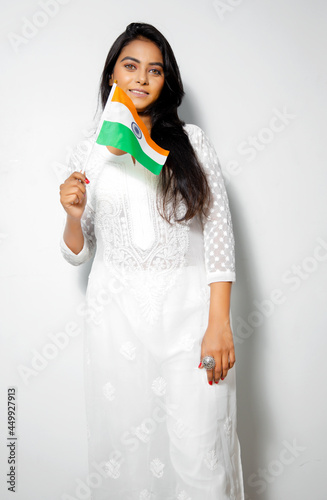 Asian woman Wear White kurta holding Indian Tricolor Flag